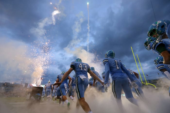 Tulane players walking out of the tunnel.