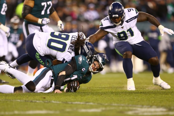 Carson Wentz takes a big blow to the head from Jadeveon Clowney of the Seahawks.