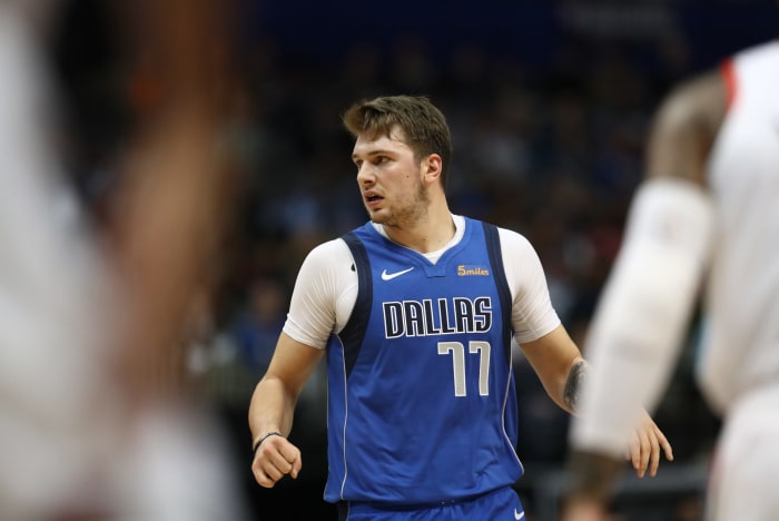 Luka Doncic looking around during a game.
