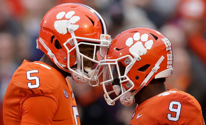 Tee Higgins #5 and Travis Etienne #9 of Clemson celebrate.