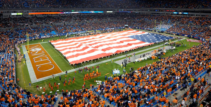 A general view of Clemson's football stadium with an American flag stretched across the football stadium.