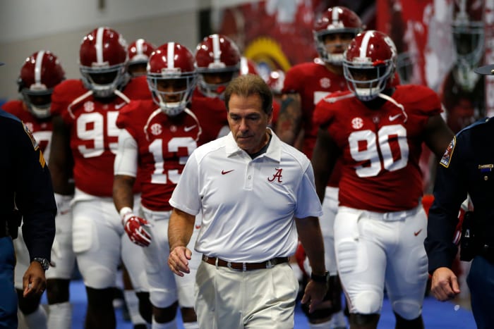 Head coach Nick Saban of the Alabama Crimson Tide walks on the field against the Florida Gators before the SEC Championship at the Georgia Dome.