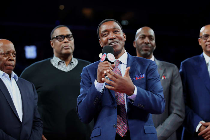 Former Detroit Pistons guard Isiah Thomas speaks at midcourt.