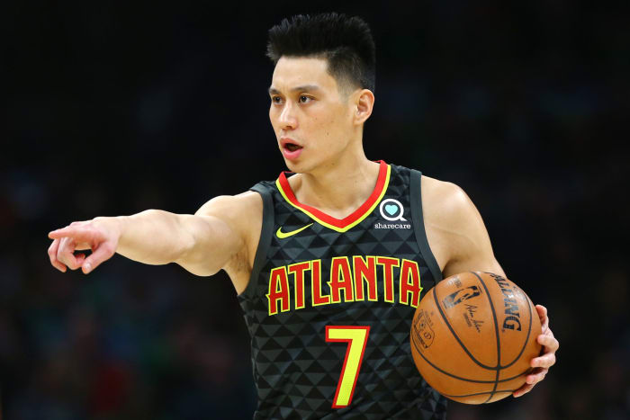 jeremy lin dribbles down the court during a game