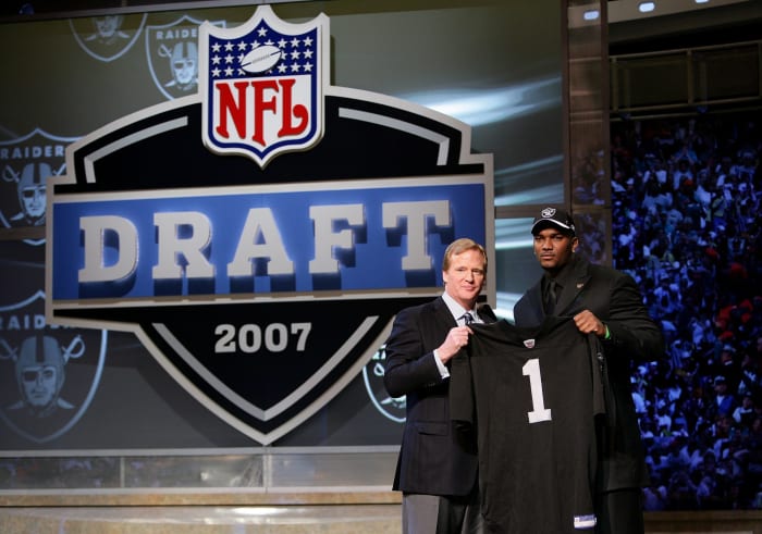 Jamarcus Russell with Roger Goodell after getting drafted.