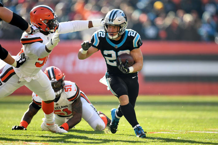 Christian McCaffrey evading a tackle.