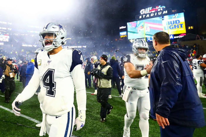 The Dallas Cowboys walk off the field after a loss to New England.