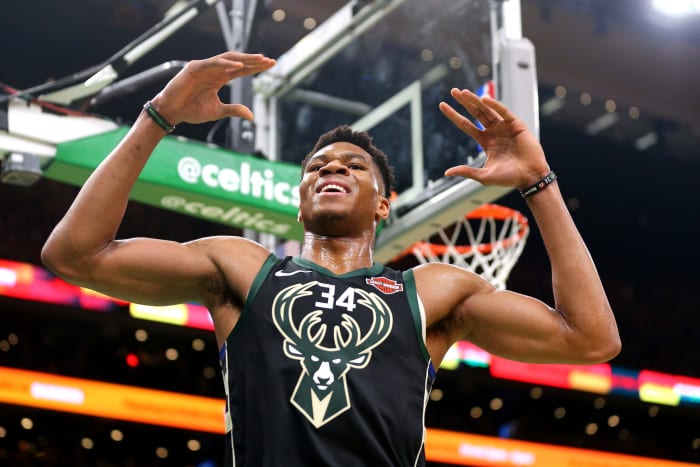 A closeup of Giannis Antetokounmpo reacting to a call during a game.