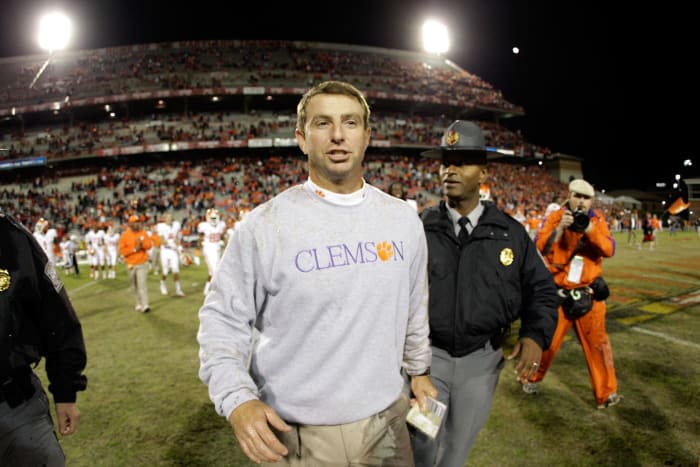 Clemson head coach Dabo Swinney running off the field.