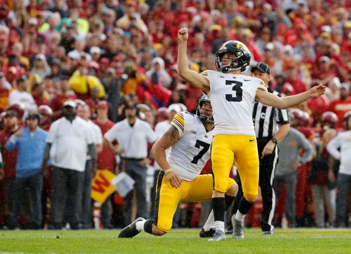Keith Duncan of the Iowa Hawkeyes kicks a field goal.