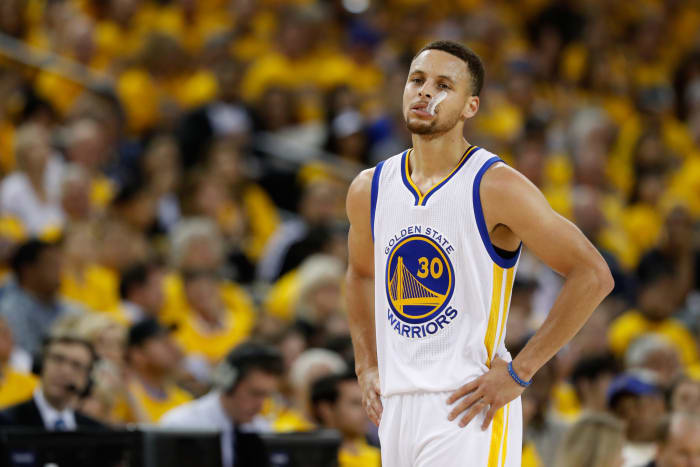 Steph Curry chewing on his mouth guard.