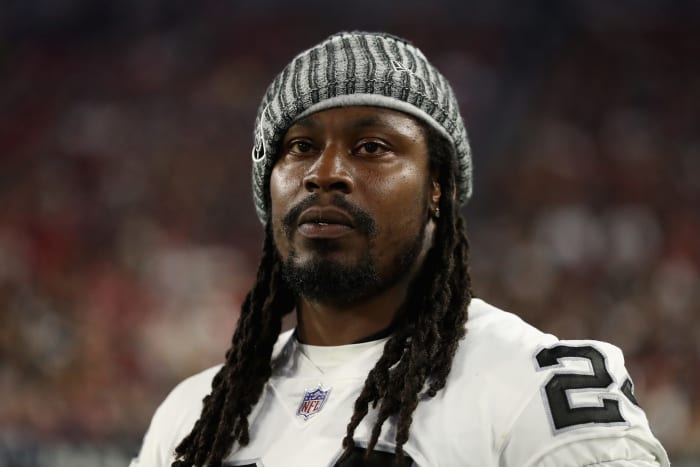 Marshawn Lynch wearing a beanie on the Oakland Raiders sideline.