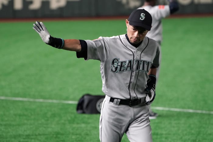 ichiro suzuki waves to fans during a game in japan