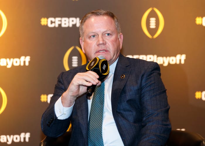 A closeup of Brian Kelly addressing the media.