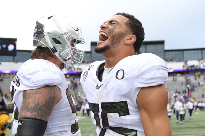 Troy Dye celebrates Oregon's win over Washington.