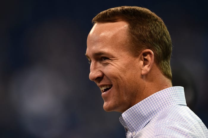 Peyton Manning in a collard shirt.