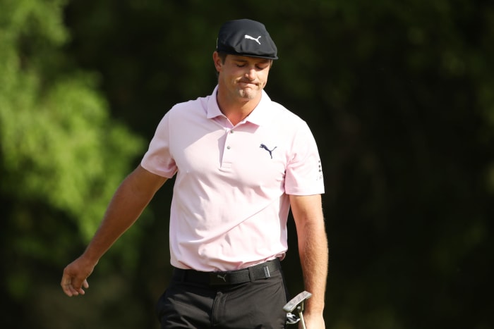 Bryson DeChambeau reacting to a missed put.