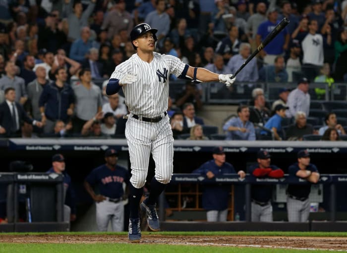 New York Yankees OF Giancarlo Stanton swinging a baseball bat.