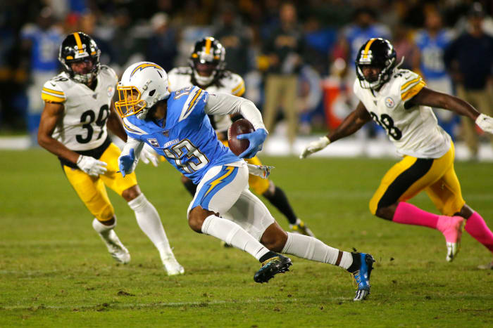 Keenan Allen runs the ball for the Los Angeles Chargers.