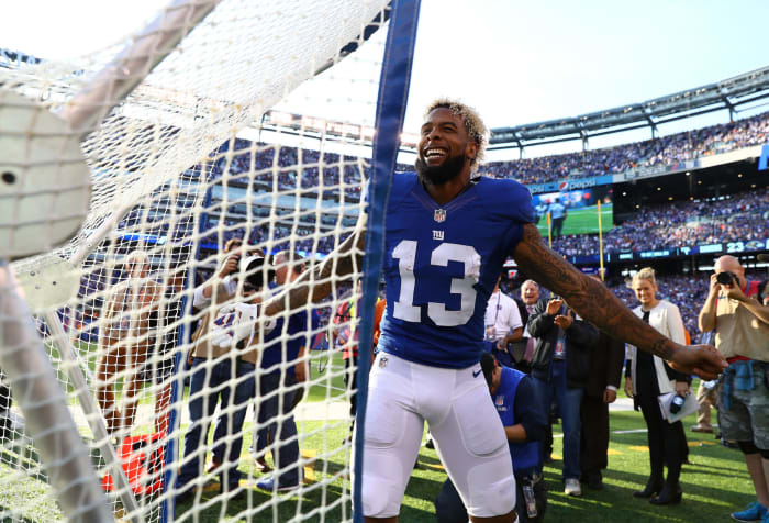 Odell Beckham Jr. next to a kicking net.