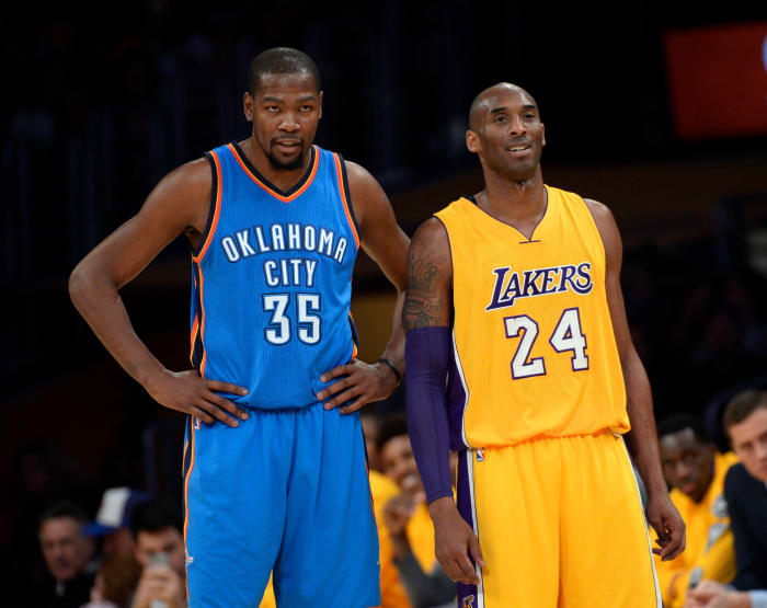 LOS ANGELES, CA - JANUARY 8: Kobe Bryant #24 of the Los Angeles Lakers talks with Kevin Durant #35 of the Oklahoma City Thunder during the first quarter of the basketball game at Staples Center January 8, 2015, in Los Angeles, California. (Photo by Kevork Djansezian/Getty Images)