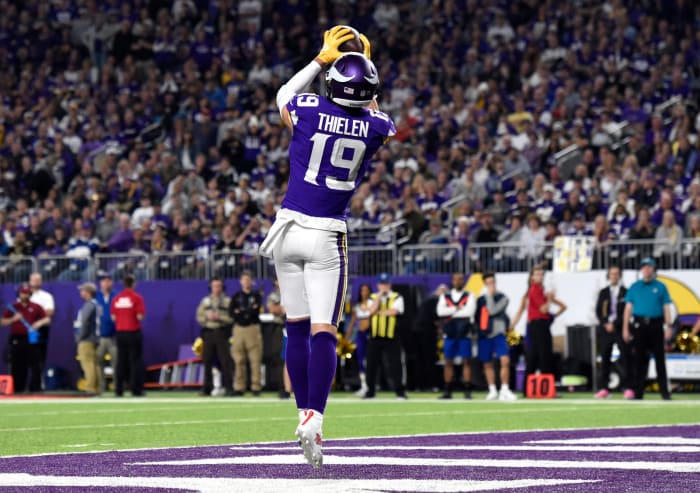 Adam Thielen catching a touchdown pass.
