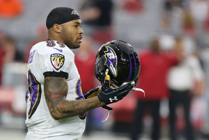 Steve Smith holding his Ravens helmet.