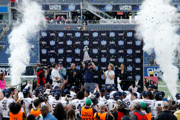 Camping World Bowl trophy presentation.