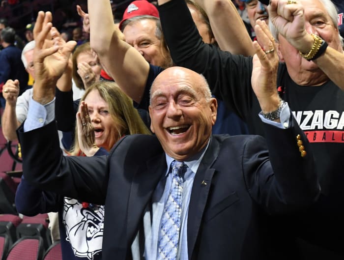 Dick Vitale celebrating with fans.
