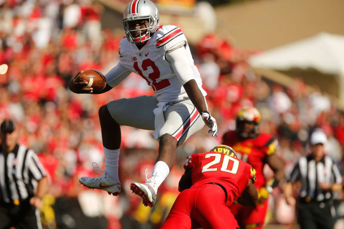 Cardale Jones hurdling a Maryland defender.