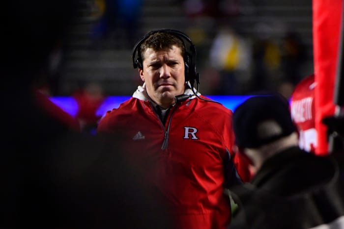 A closeup of Rutgers coach Chris Ash during a football game.