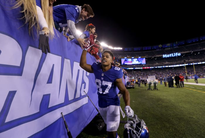 Sterling Shepard interacting with fans after a Giants game.