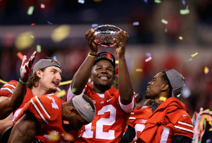 Cardale Jones holding up a trophy after Ohio State beat Wisconsin to win the Big Ten.