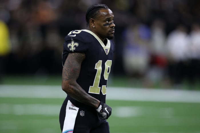 Teg Ginn Jr walks around the field.