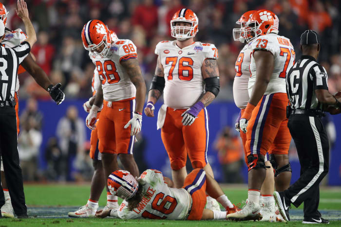 Trevor Lawrence is down after a hit by Shaun Wade.