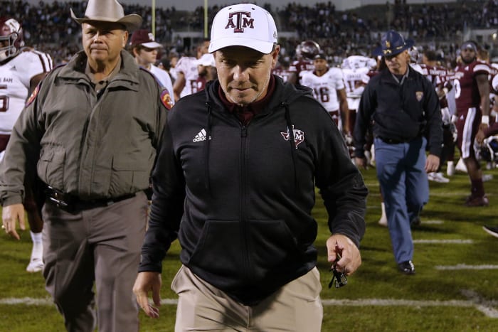 jimbo fisher walks off the field after a Texas A&M football game