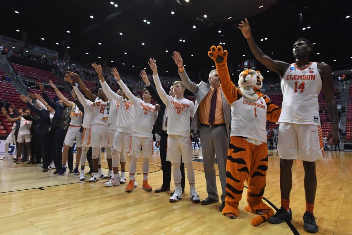 The Clemson Tigers celebrate their 79-68 win over the New Mexico State Aggies.
