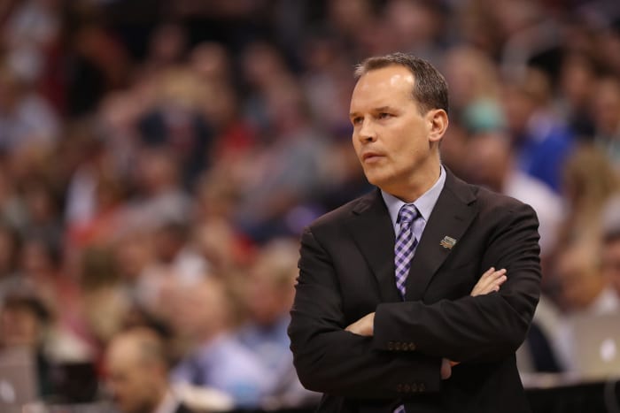 Northwestern coach Chris Collins crossing his arms.