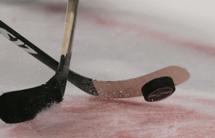 A generic photo of a hockey faceoff.