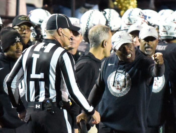 Vanderbilt head coach Derek Mason talking to a referee.