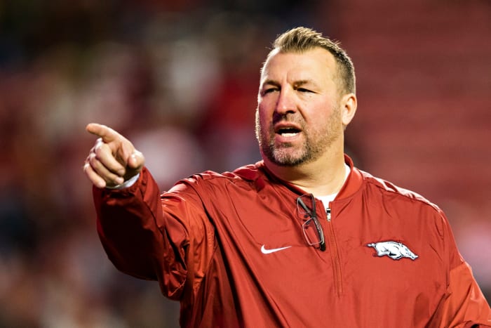 A closeup of Bret Bielema in an Arkansas jumpsuit.