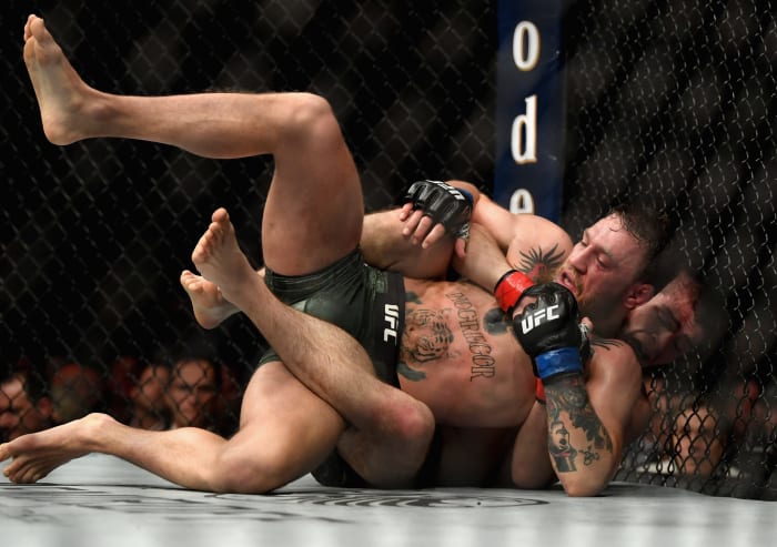 Khabib beating Conor McGregor in a UFC fight.