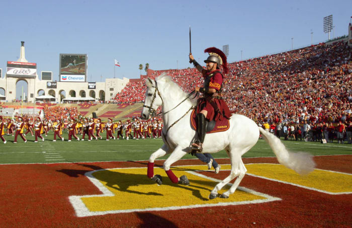 USC's mascot riding on a white horse in the end zone.