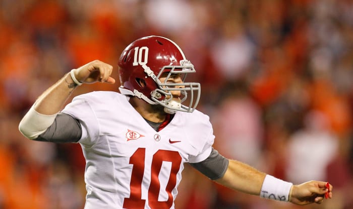 AJ McCarron of the Alabama Crimson Tide reacts after a long offensive play against the Auburn Tigers at Jordan-Hare Stadium.
