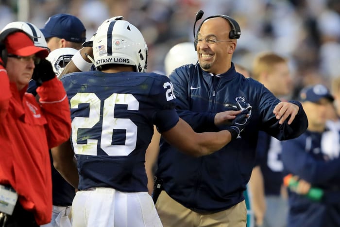 James Franklin congratulating Saquon Barkley on the sideline.