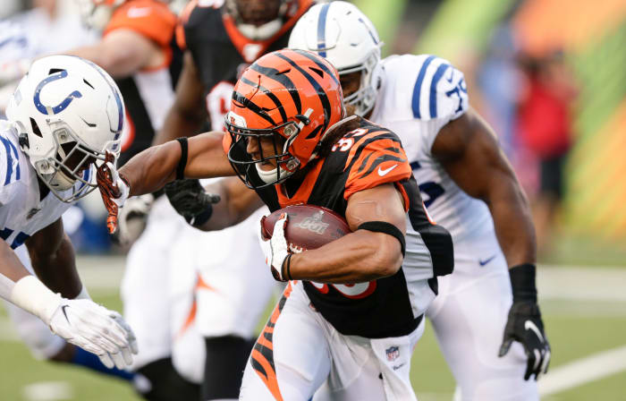 Rodney Anderson stiff-arms an opponent.