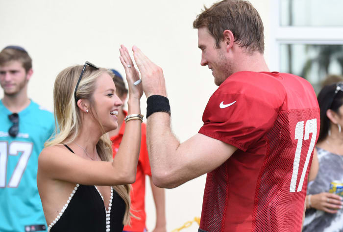 Ryan Tannehill and wife Lauren celebrate at practice.