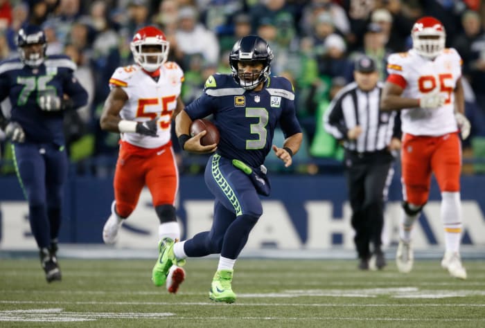 Seattle Seahawks QB Russell Wilson running with the football.