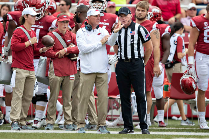 Arkansas head coach Chad Morris talking to a referee.