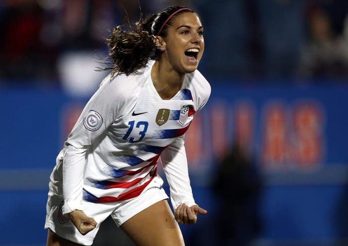 Alex Morgan celebrates after scoring a goal for the USA.
